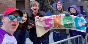 Dr. Kaplan's supporters cheer him on at the 2023 NYC Half Marathon